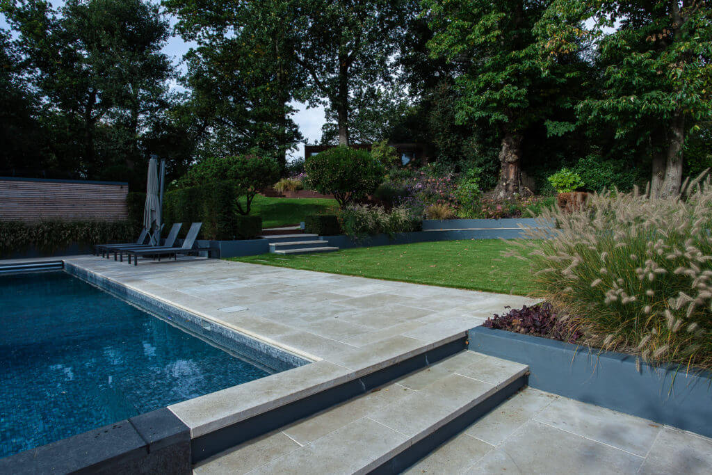 A picture of a garden with a pool