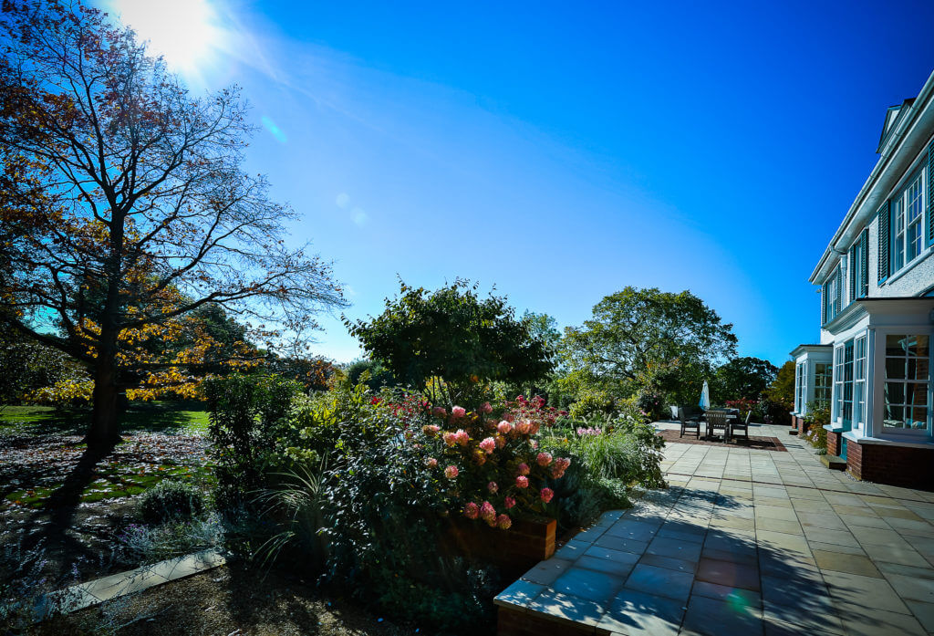 A photo of the outside of a house with a garden