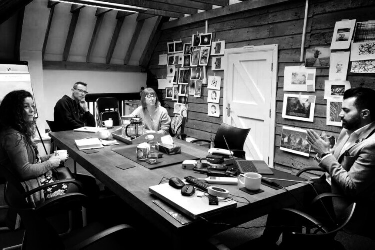 black and white image of people in a meeting
