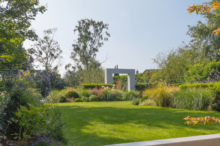 concept of a modern garden with a square sculpture