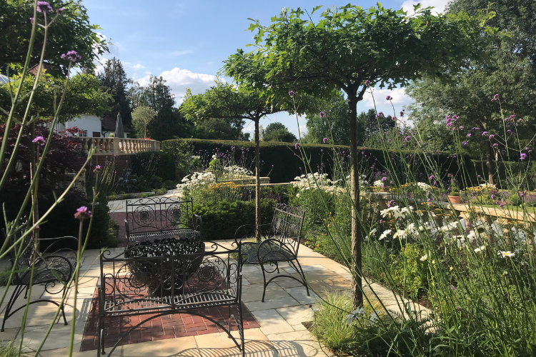 metal garden bench spring garden inspiration for hedgerows