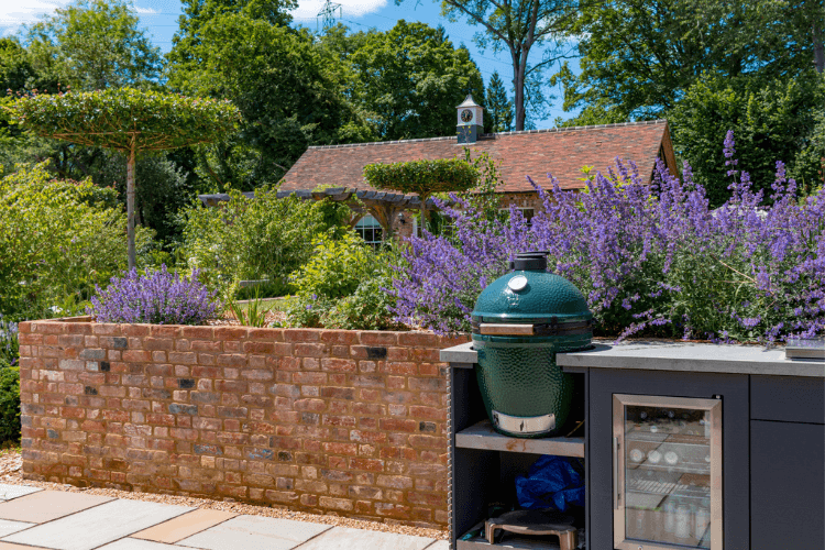 tree shade over an outdoor kitchen spring garden inspiration for hedgerows